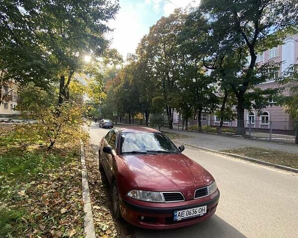 Красный Мицубиси Харизма, объемом двигателя 1.6 л и пробегом 450 тыс. км за 3000 $, фото 3 на Automoto.ua