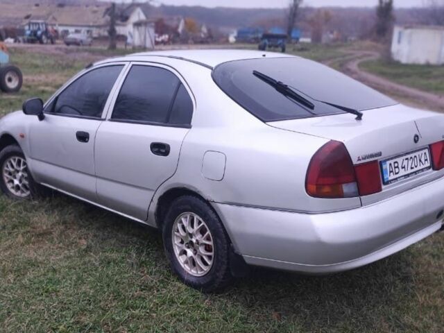 Серый Мицубиси Харизма, объемом двигателя 1.6 л и пробегом 1 тыс. км за 1400 $, фото 2 на Automoto.ua