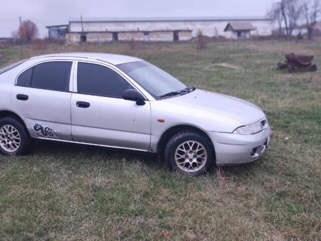 Серый Мицубиси Харизма, объемом двигателя 1.6 л и пробегом 1 тыс. км за 1400 $, фото 3 на Automoto.ua