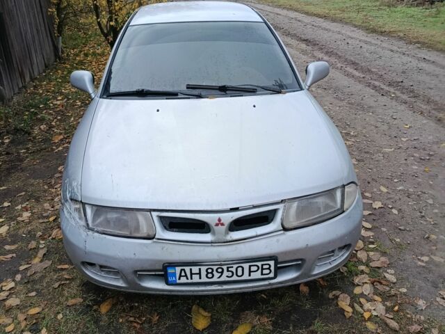 Сірий Міцубісі Харизма, об'ємом двигуна 1.8 л та пробігом 250 тис. км за 1207 $, фото 1 на Automoto.ua