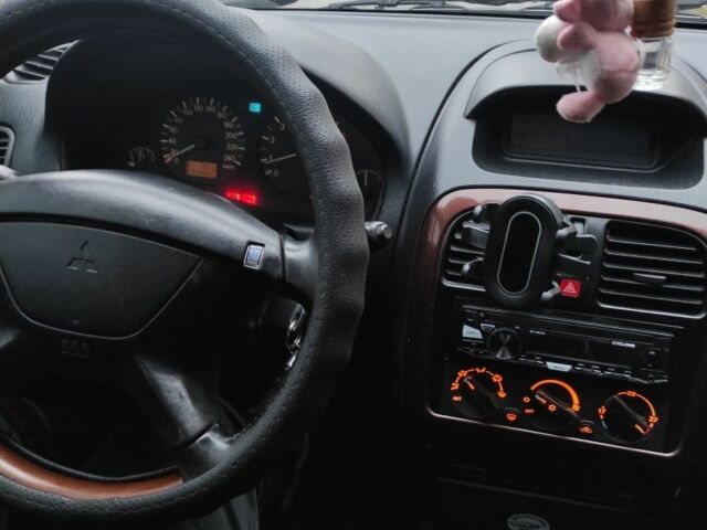 Сірий Міцубісі Харизма, об'ємом двигуна 1.8 л та пробігом 379 тис. км за 1307 $, фото 6 на Automoto.ua