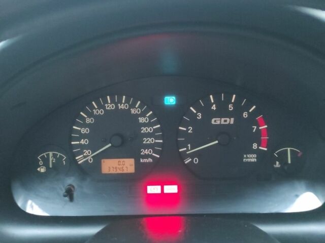 Сірий Міцубісі Харизма, об'ємом двигуна 1.8 л та пробігом 379 тис. км за 1307 $, фото 7 на Automoto.ua