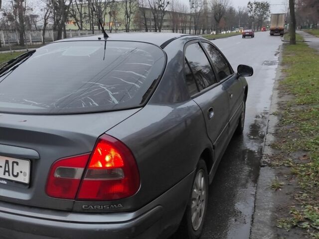 Сірий Міцубісі Харизма, об'ємом двигуна 1.8 л та пробігом 379 тис. км за 1307 $, фото 1 на Automoto.ua