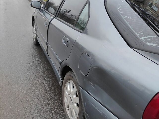 Сірий Міцубісі Харизма, об'ємом двигуна 1.8 л та пробігом 379 тис. км за 1307 $, фото 4 на Automoto.ua