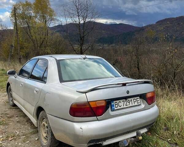 Серый Мицубиси Харизма, объемом двигателя 1.6 л и пробегом 270 тыс. км за 750 $, фото 3 на Automoto.ua