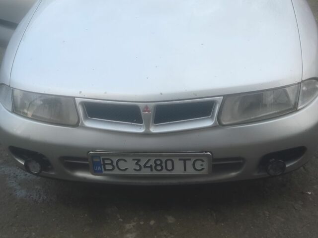 Серый Мицубиси Харизма, объемом двигателя 1.9 л и пробегом 280 тыс. км за 1200 $, фото 1 на Automoto.ua