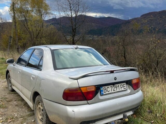 Серый Мицубиси Харизма, объемом двигателя 1.6 л и пробегом 270 тыс. км за 750 $, фото 4 на Automoto.ua