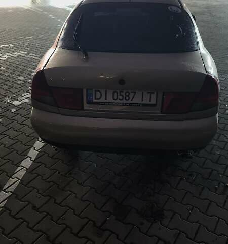 Серый Мицубиси Харизма, объемом двигателя 1.83 л и пробегом 350 тыс. км за 1500 $, фото 4 на Automoto.ua