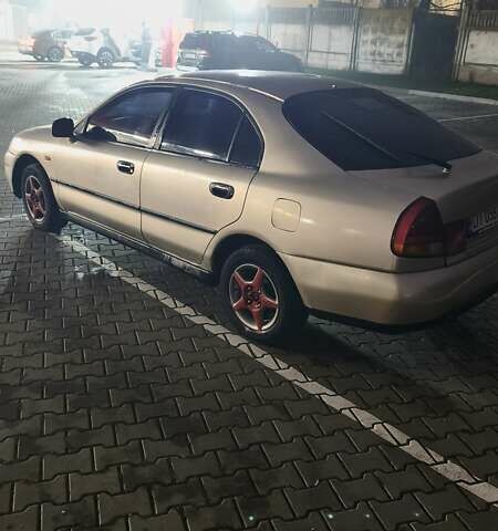 Серый Мицубиси Харизма, объемом двигателя 1.83 л и пробегом 350 тыс. км за 1500 $, фото 3 на Automoto.ua