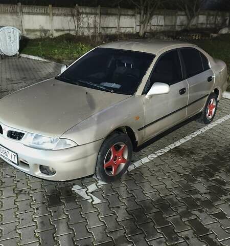 Серый Мицубиси Харизма, объемом двигателя 1.83 л и пробегом 350 тыс. км за 1500 $, фото 2 на Automoto.ua