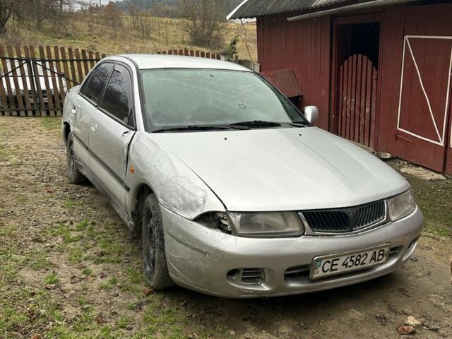 Сірий Міцубісі Харизма, об'ємом двигуна 1.9 л та пробігом 350 тис. км за 1000 $, фото 1 на Automoto.ua