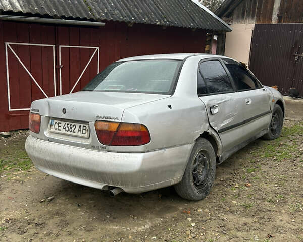 Сірий Міцубісі Харизма, об'ємом двигуна 1.9 л та пробігом 368 тис. км за 1000 $, фото 3 на Automoto.ua