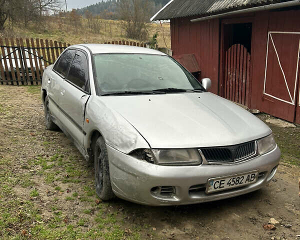 Сірий Міцубісі Харизма, об'ємом двигуна 1.9 л та пробігом 368 тис. км за 1000 $, фото 1 на Automoto.ua