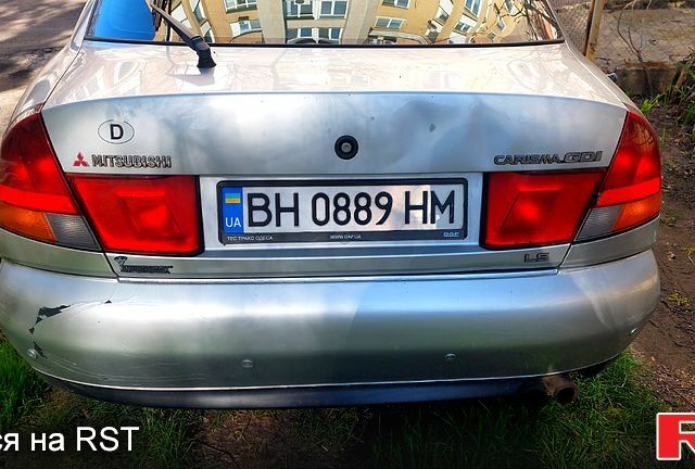 Серый Мицубиси Харизма, объемом двигателя 1.8 л и пробегом 320 тыс. км за 1600 $, фото 1 на Automoto.ua