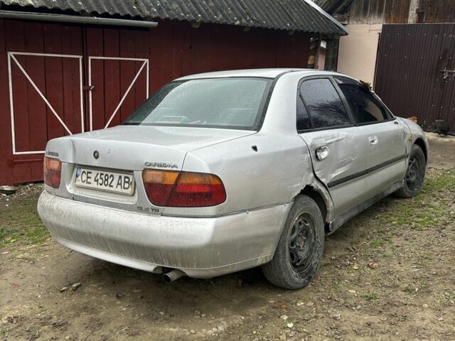 Сірий Міцубісі Харизма, об'ємом двигуна 1.9 л та пробігом 350 тис. км за 1000 $, фото 4 на Automoto.ua