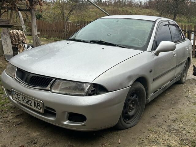 Сірий Міцубісі Харизма, об'ємом двигуна 1.9 л та пробігом 350 тис. км за 1000 $, фото 2 на Automoto.ua