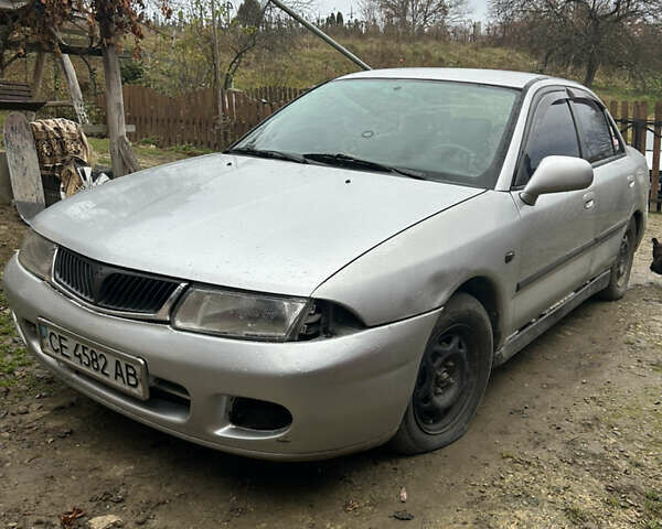 Сірий Міцубісі Харизма, об'ємом двигуна 1.9 л та пробігом 368 тис. км за 1000 $, фото 2 на Automoto.ua