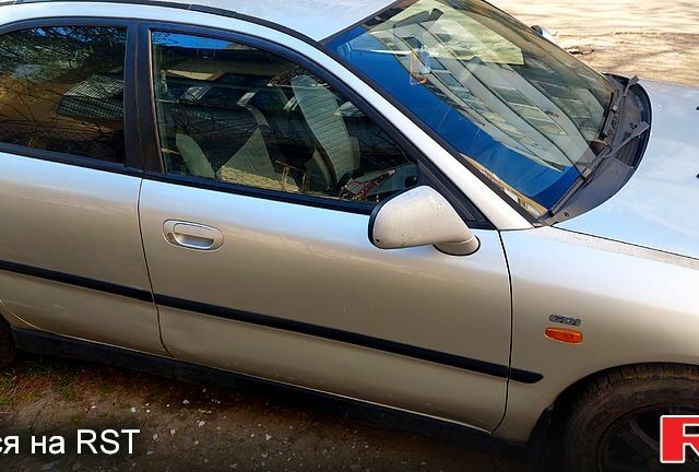 Серый Мицубиси Харизма, объемом двигателя 1.8 л и пробегом 320 тыс. км за 1600 $, фото 3 на Automoto.ua