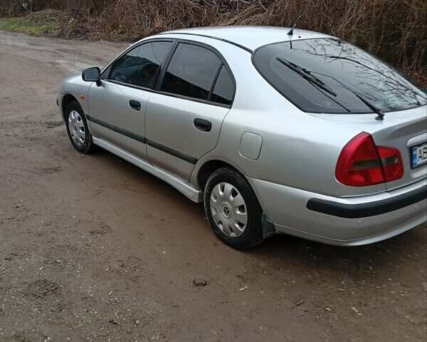 Серый Мицубиси Харизма, объемом двигателя 1.6 л и пробегом 320 тыс. км за 3000 $, фото 2 на Automoto.ua