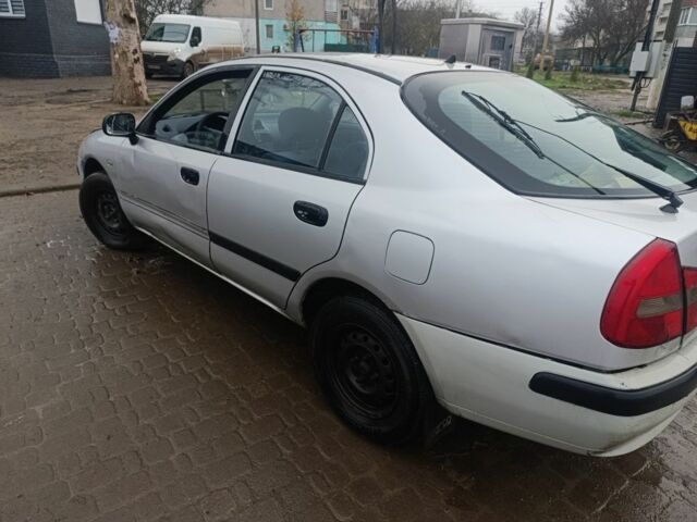 Серый Мицубиси Харизма, объемом двигателя 1.9 л и пробегом 280 тыс. км за 700 $, фото 5 на Automoto.ua