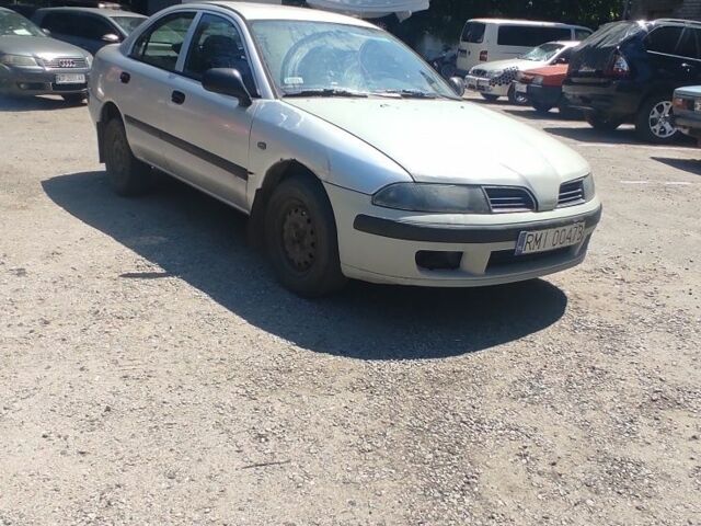 Сірий Міцубісі Харизма, об'ємом двигуна 1.9 л та пробігом 250 тис. км за 800 $, фото 1 на Automoto.ua