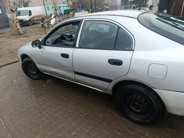 Серый Мицубиси Харизма, объемом двигателя 1.9 л и пробегом 280 тыс. км за 700 $, фото 2 на Automoto.ua