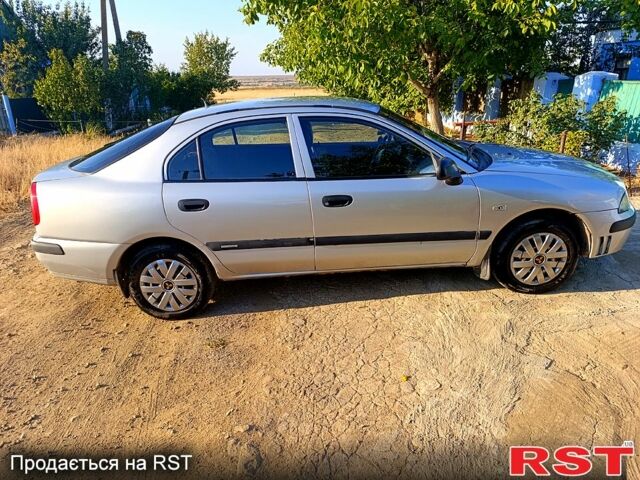 Сірий Міцубісі Харизма, об'ємом двигуна 1.9 л та пробігом 0 тис. км за 2600 $, фото 2 на Automoto.ua