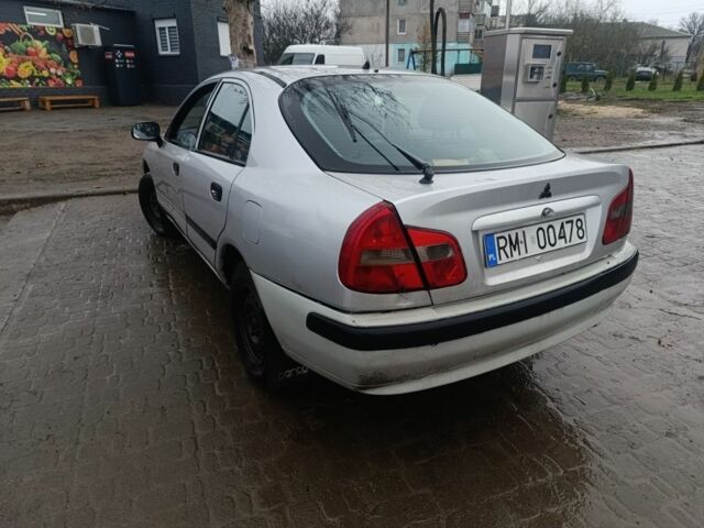 Серый Мицубиси Харизма, объемом двигателя 1.9 л и пробегом 280 тыс. км за 700 $, фото 1 на Automoto.ua