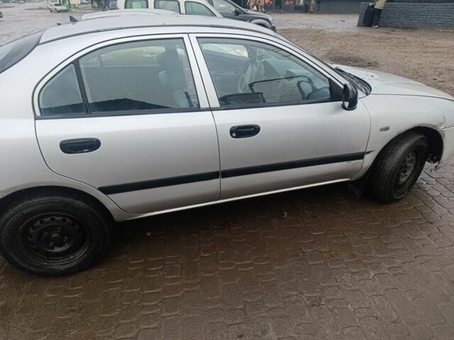 Серый Мицубиси Харизма, объемом двигателя 1.9 л и пробегом 280 тыс. км за 700 $, фото 3 на Automoto.ua