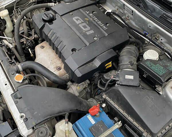 Сірий Міцубісі Харизма, об'ємом двигуна 1.83 л та пробігом 265 тис. км за 2850 $, фото 20 на Automoto.ua