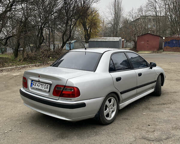 Сірий Міцубісі Харизма, об'ємом двигуна 1.83 л та пробігом 265 тис. км за 2850 $, фото 3 на Automoto.ua