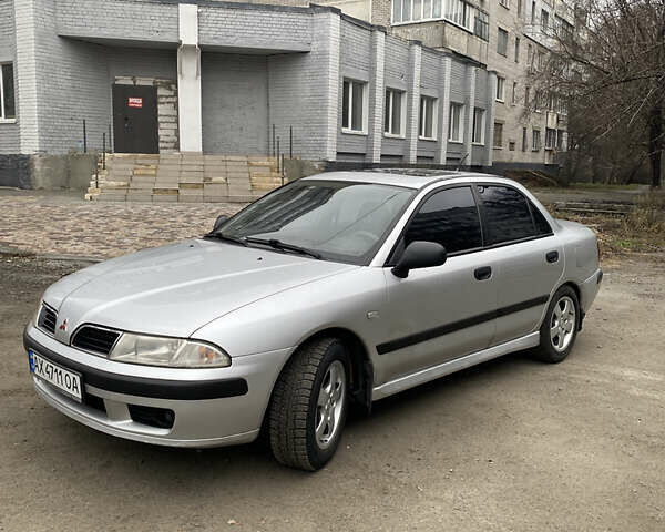 Сірий Міцубісі Харизма, об'ємом двигуна 1.83 л та пробігом 265 тис. км за 2850 $, фото 9 на Automoto.ua