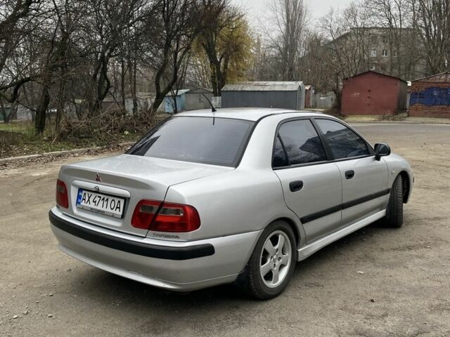 Серый Мицубиси Харизма, объемом двигателя 1.8 л и пробегом 265 тыс. км за 2850 $, фото 3 на Automoto.ua