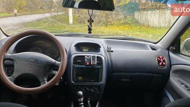 Серый Мицубиси Харизма, объемом двигателя 1.6 л и пробегом 250 тыс. км за 2600 $, фото 12 на Automoto.ua