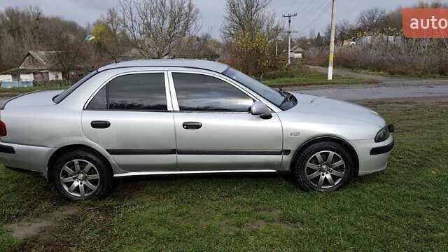 Серый Мицубиси Харизма, объемом двигателя 1.6 л и пробегом 250 тыс. км за 2600 $, фото 4 на Automoto.ua