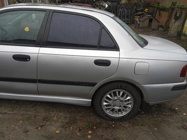 Серый Мицубиси Харизма, объемом двигателя 1.8 л и пробегом 224 тыс. км за 3600 $, фото 9 на Automoto.ua