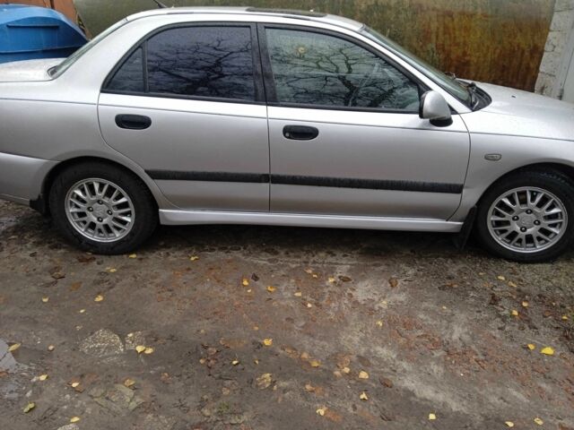 Серый Мицубиси Харизма, объемом двигателя 1.8 л и пробегом 224 тыс. км за 3600 $, фото 13 на Automoto.ua