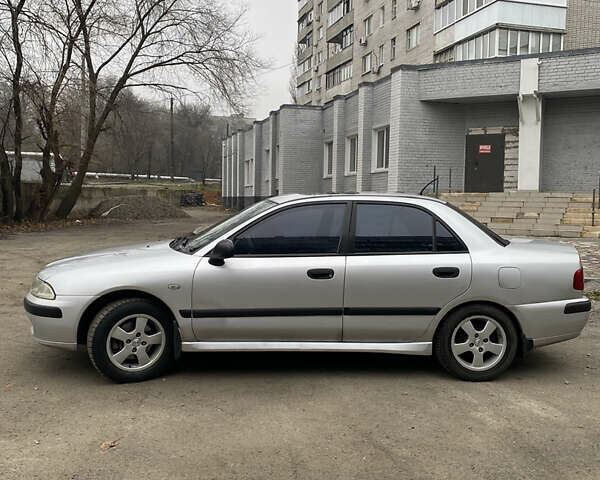 Сірий Міцубісі Харизма, об'ємом двигуна 1.83 л та пробігом 265 тис. км за 2850 $, фото 8 на Automoto.ua