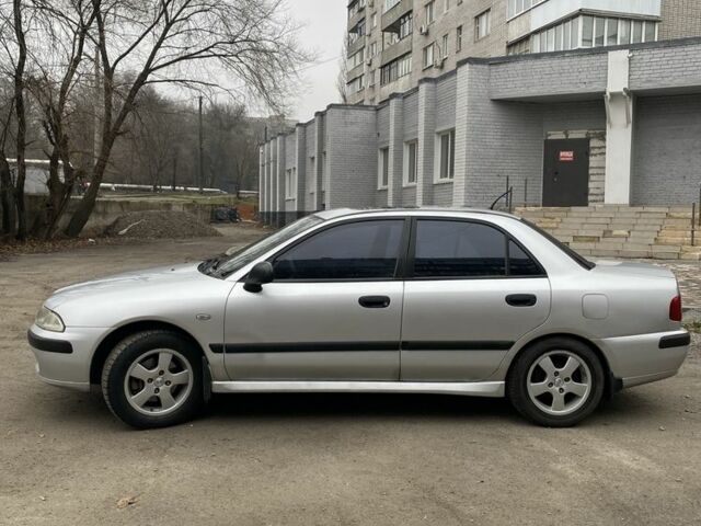 Серый Мицубиси Харизма, объемом двигателя 1.8 л и пробегом 265 тыс. км за 2850 $, фото 8 на Automoto.ua