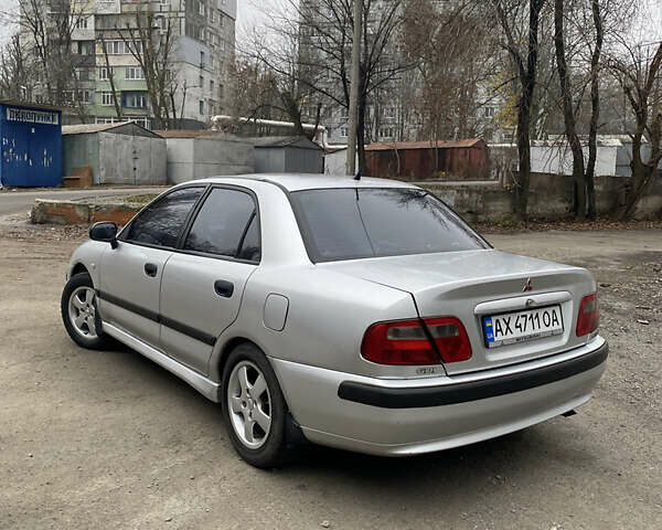 Сірий Міцубісі Харизма, об'ємом двигуна 1.83 л та пробігом 265 тис. км за 2850 $, фото 6 на Automoto.ua