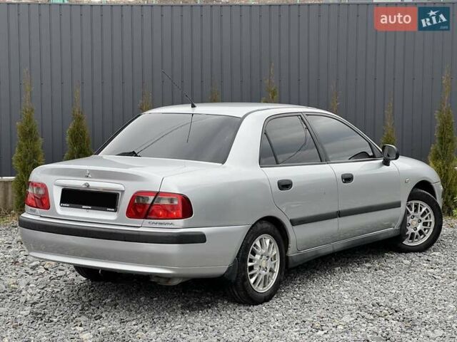 Серый Мицубиси Харизма, объемом двигателя 1.83 л и пробегом 326 тыс. км за 3400 $, фото 4 на Automoto.ua