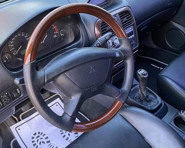 Сірий Міцубісі Харизма, об'ємом двигуна 1.83 л та пробігом 325 тис. км за 3000 $, фото 21 на Automoto.ua
