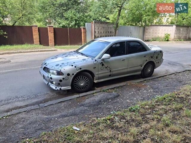 Сірий Міцубісі Харизма, об'ємом двигуна 1.6 л та пробігом 342 тис. км за 3200 $, фото 4 на Automoto.ua