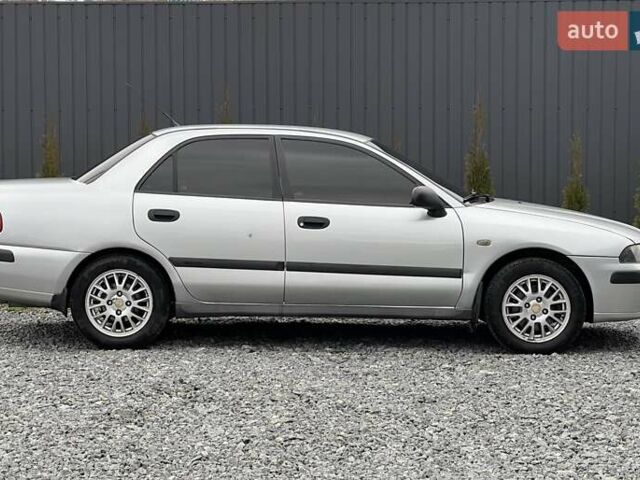 Серый Мицубиси Харизма, объемом двигателя 1.83 л и пробегом 326 тыс. км за 3400 $, фото 2 на Automoto.ua