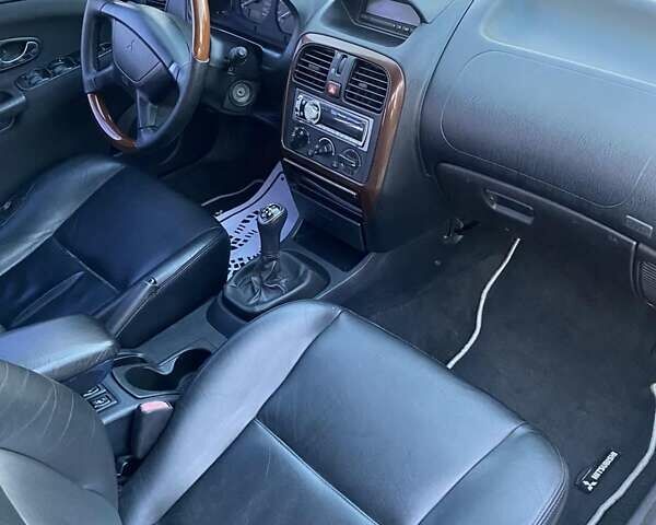 Сірий Міцубісі Харизма, об'ємом двигуна 1.83 л та пробігом 325 тис. км за 3000 $, фото 12 на Automoto.ua