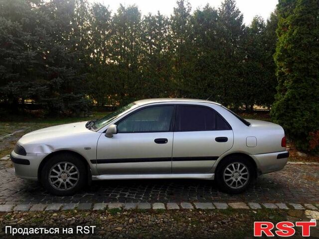 Серый Мицубиси Харизма, объемом двигателя 1.6 л и пробегом 310 тыс. км за 2150 $, фото 1 на Automoto.ua