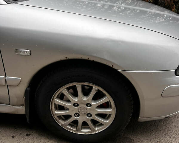 Серый Мицубиси Харизма, объемом двигателя 1.6 л и пробегом 267 тыс. км за 3700 $, фото 16 на Automoto.ua