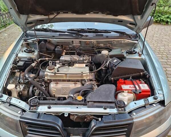 Серый Мицубиси Харизма, объемом двигателя 1.6 л и пробегом 286 тыс. км за 4800 $, фото 9 на Automoto.ua