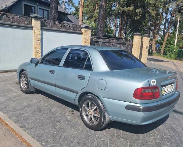 Серый Мицубиси Харизма, объемом двигателя 1.6 л и пробегом 286 тыс. км за 4800 $, фото 3 на Automoto.ua