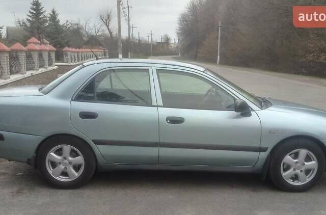 Сірий Міцубісі Харизма, об'ємом двигуна 1.6 л та пробігом 275 тис. км за 2450 $, фото 1 на Automoto.ua